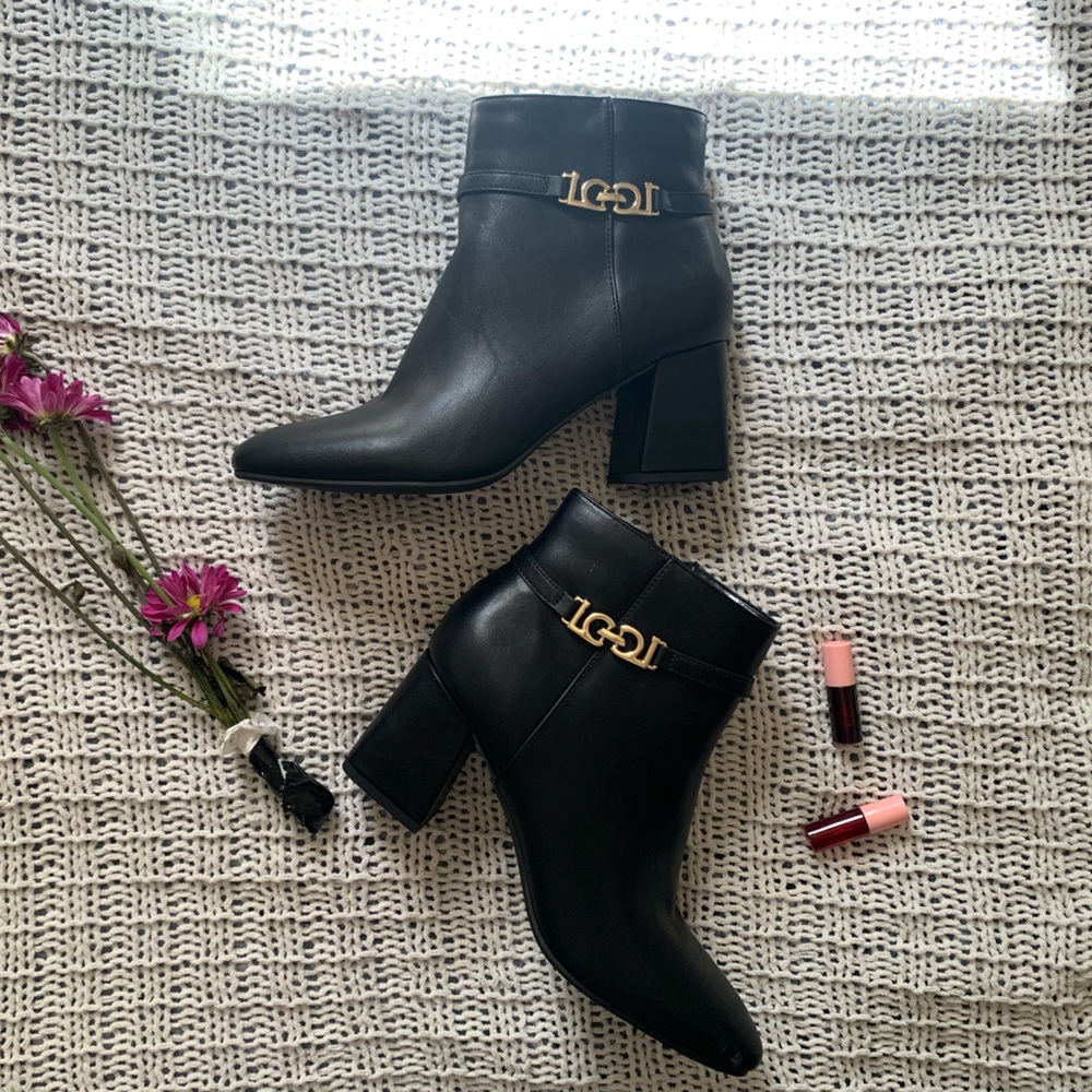 Black leather ankle boots with gold logo detail